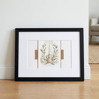 A framed art print leaning against a white wall on a light wood floor. The print features a minimalist botanical illustration of a small vase and leafy branches, surrounded by a wide white mat and a black frame.