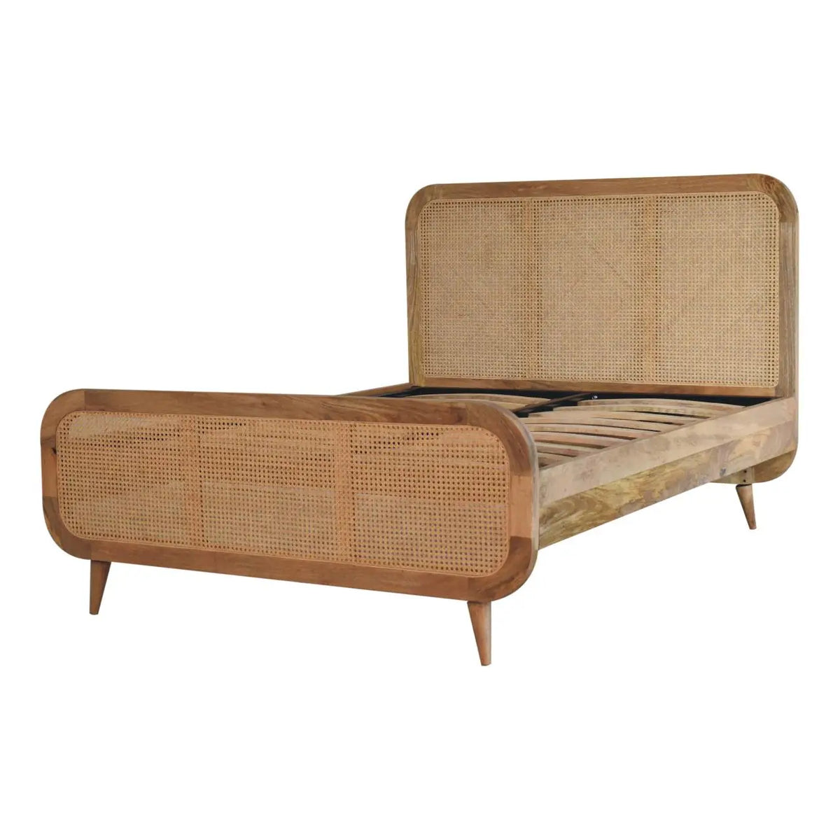 Rattan Bed with bedding, showing the height of the headboard