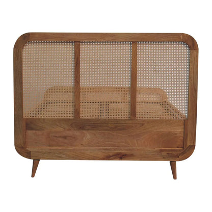 Rattan Bed in a light bedroom setting, viewed from the side